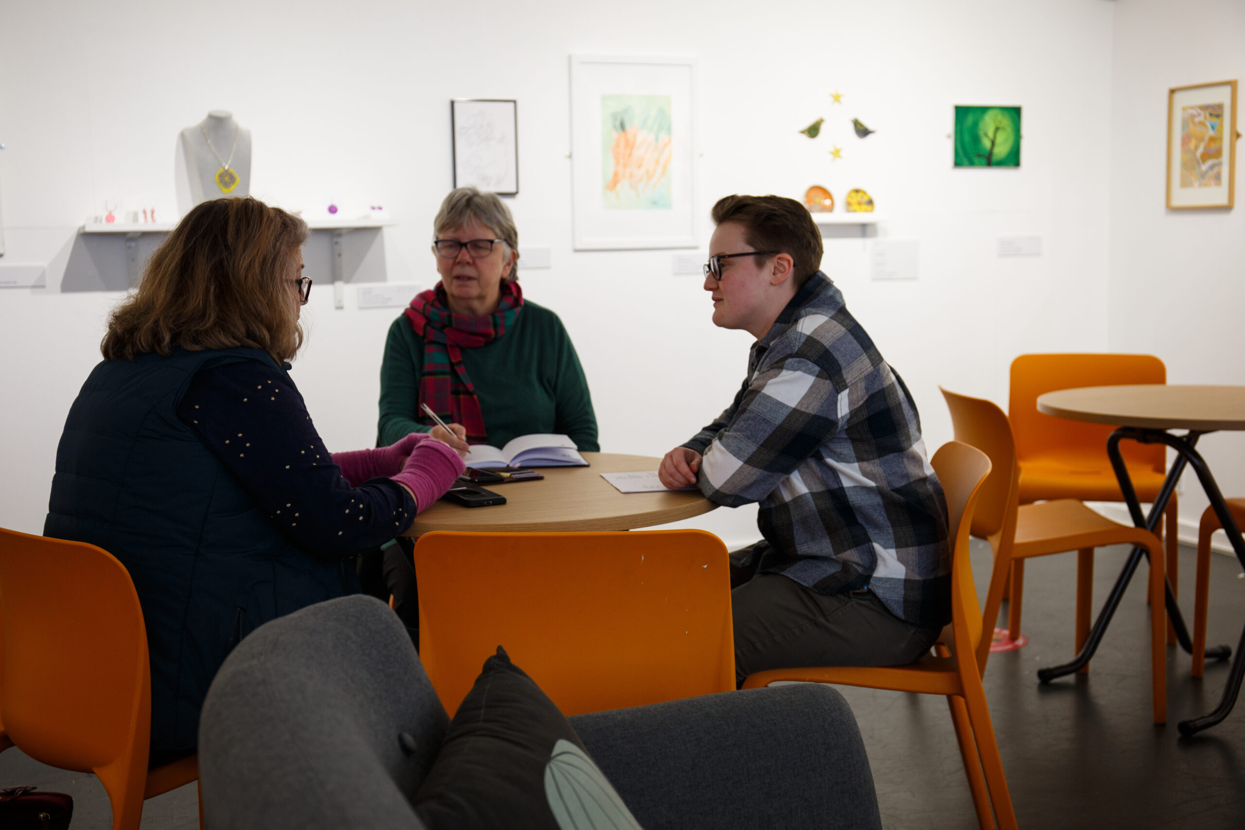 VideoHQ's Hannah Quinn conducting a video marketing review with clients in Shrewsbury