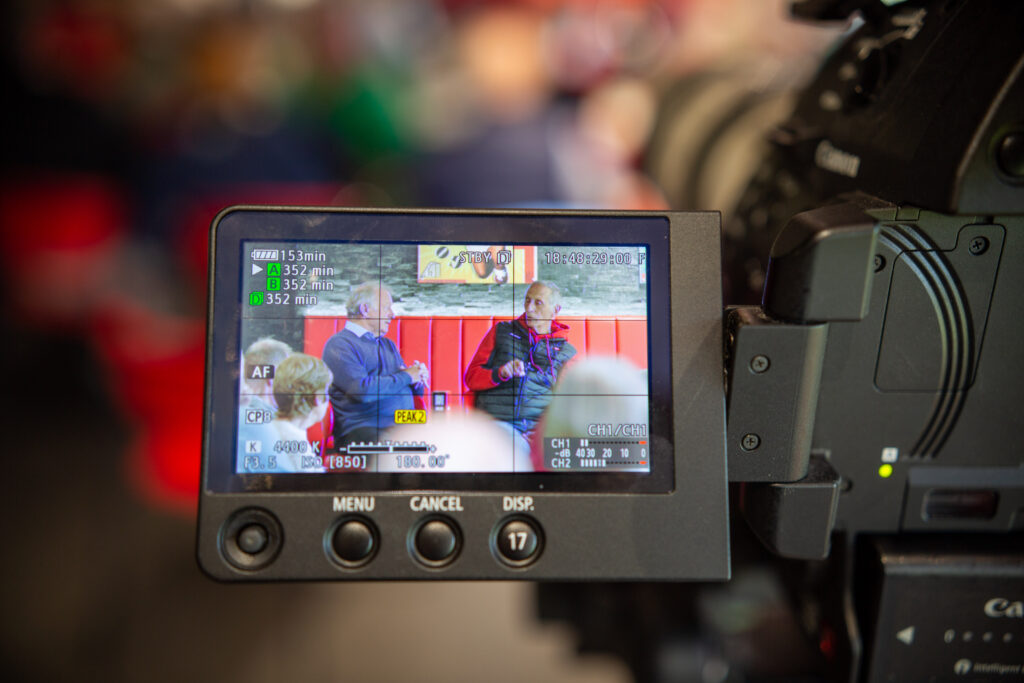 Photo shows camera filming packed Stoke Memories session at Ricardo's bar at Stoke City FC