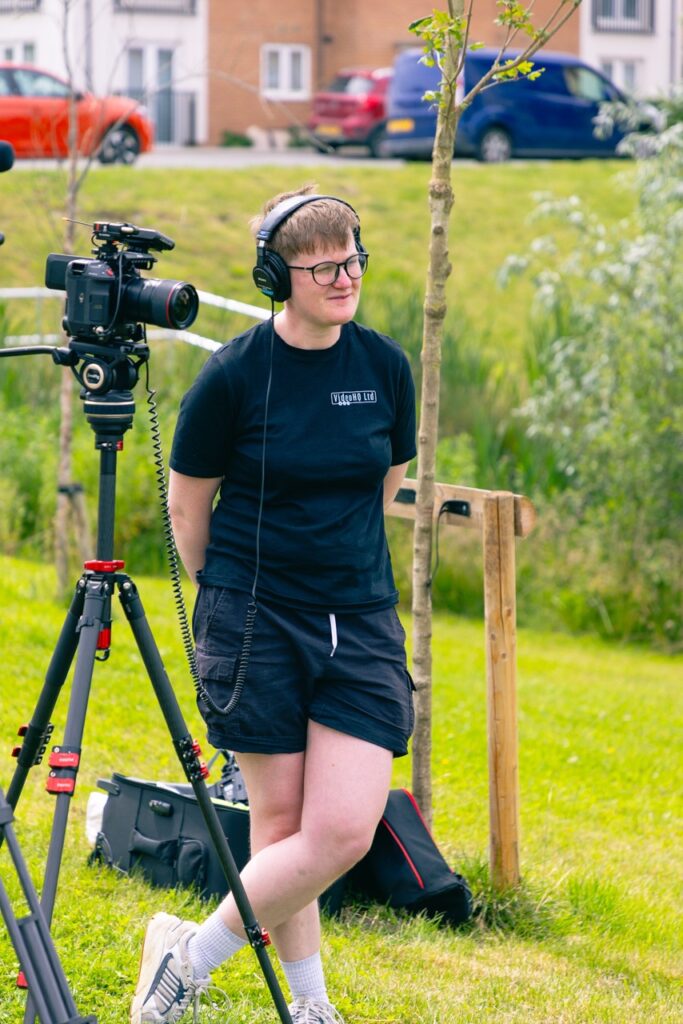 Videographer Hannah Morris-Morris-Quinn Videographer Hannah Morris-Morris-Quinn on site behind the video camera creating a case study video